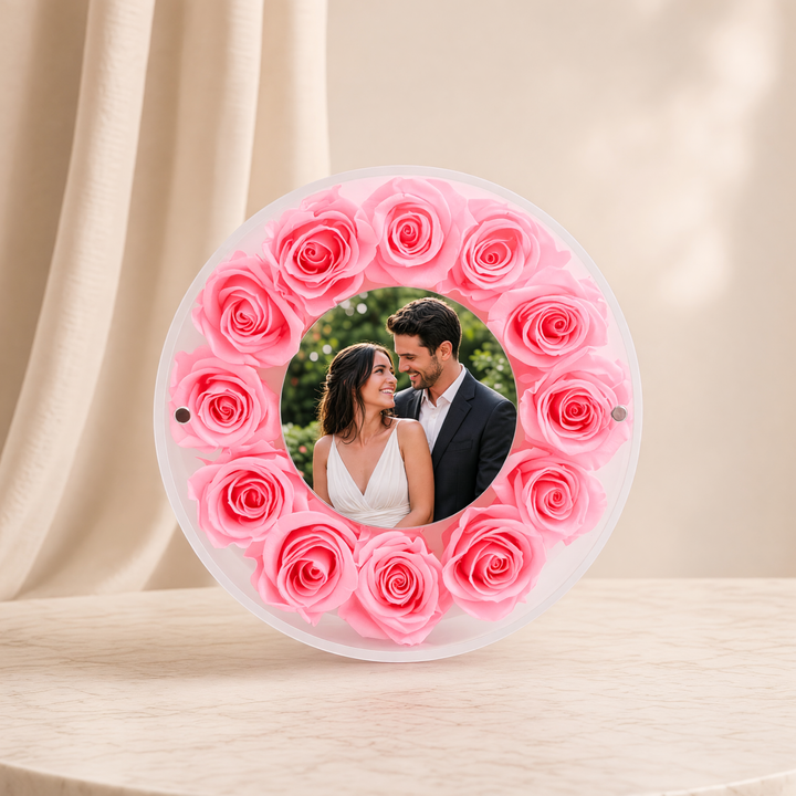 Small 6-inch round acrylic photo frame with pink preserved roses, front view