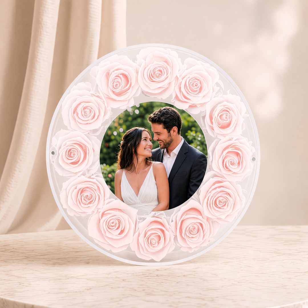 Large 10-inch round acrylic photo frame with blush preserved roses, front view