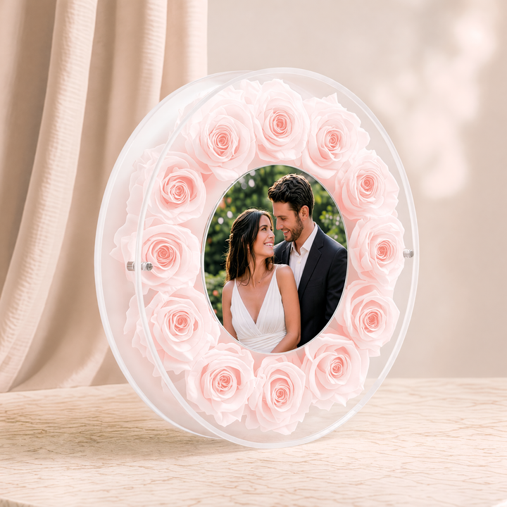 Large 10-inch round acrylic photo frame with blush preserved roses, angled view