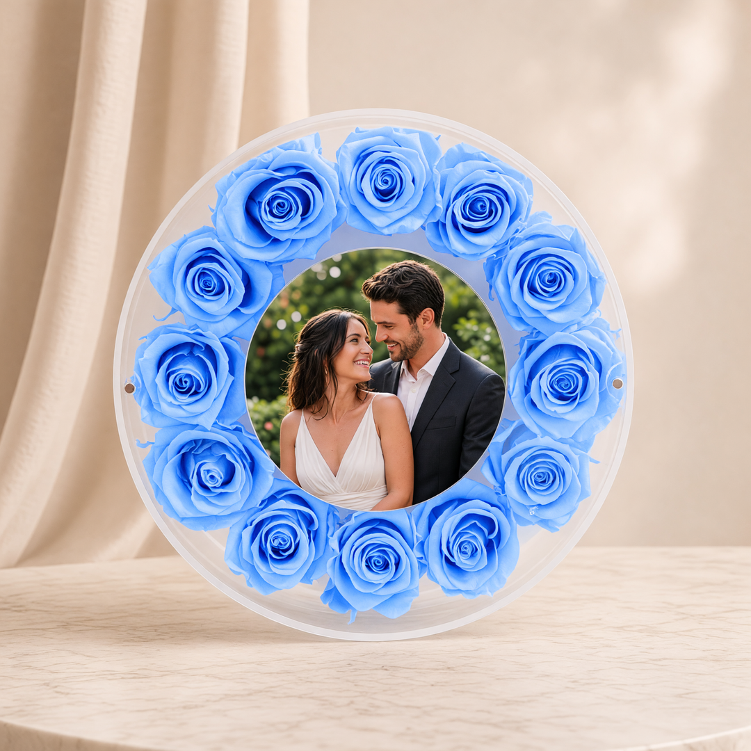 Large 10-inch round acrylic photo frame with light blue preserved roses, front view