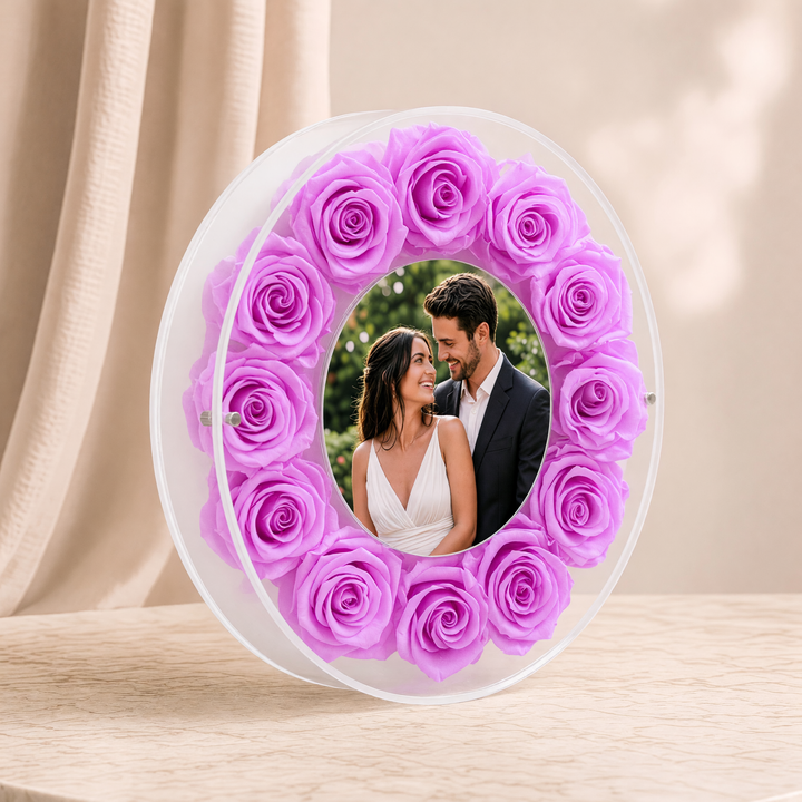 Large 10-inch round acrylic photo frame with lilac preserved roses, angled view