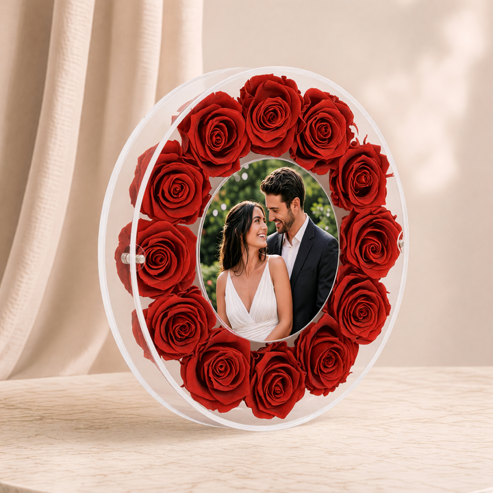 Large 10-inch round acrylic photo frame with red preserved roses, angled view