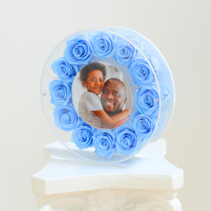 Original photograph of the light blue large Halo preserved rose frame, angle view on a white pedestal