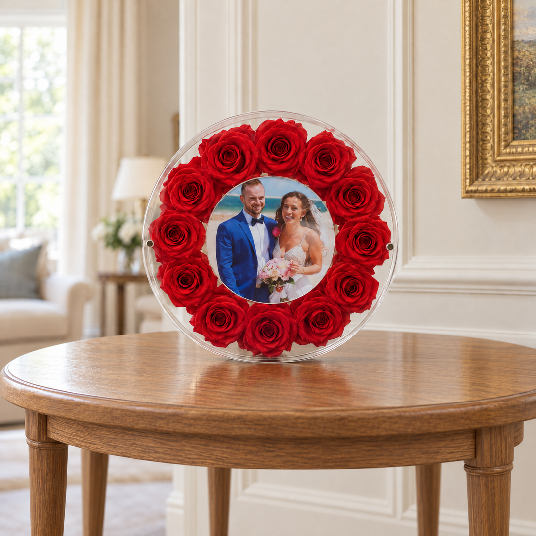 Red large Halo preserved rose photo frame, front view, standing on a wood table