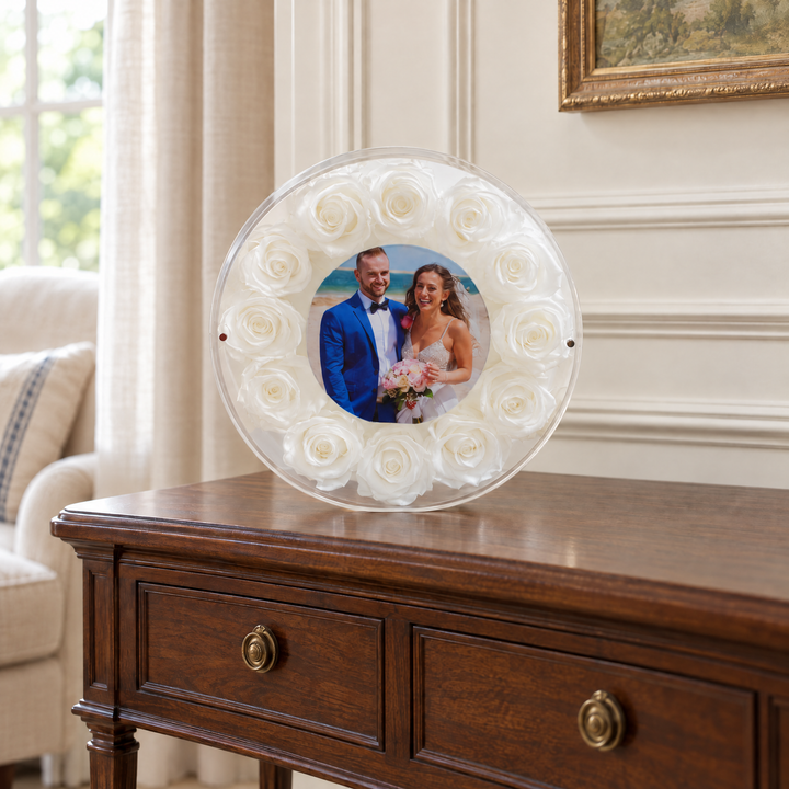 White large Halo preserved rose photo frame, front view, standing on furniture