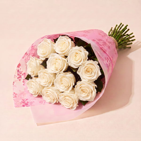 Dozen preserved roses in pink floral wrap - Ivory