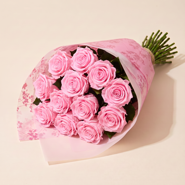 Dozen preserved roses in pink floral wrap - Pink
